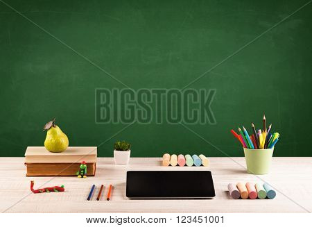 Back to school concepty with clear blackboard background, desk, items