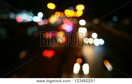 Night blur city road curved, abstract bokeh lights background