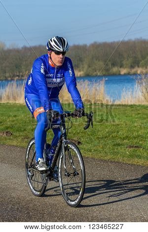 Flevoland the Netherlands - March 26 2016: a road racing cyclist.