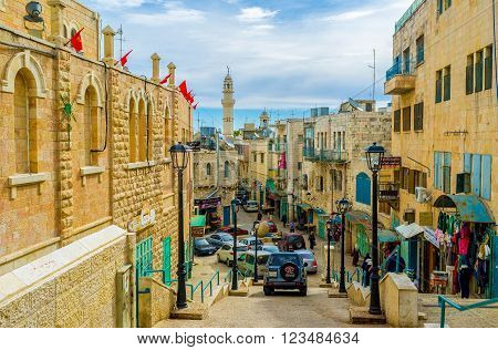 BETHLEHEM PALESTINE - FEBRUARY 18 2016: The narrow Pope Paul IV street is the central street of the city on February 18 in Bethlehem.