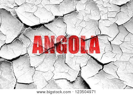 Grunge cracked Greetings from angola card with some soft highlights
