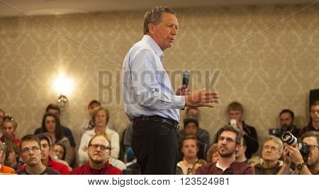 MADISON WI/USA - March 28 2016: Republican presidential candidate John Kasich speaks to a group of supporters during a town hall event before the Wisconsin presidential primary in Madison Wisconsin.