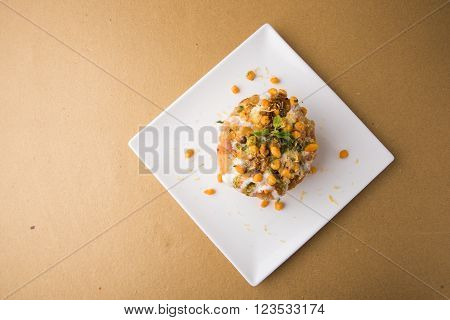 Rajasthani Shahi Raj Kachori, stuffed katchori with potato and sprout filling and served with curd, chutney and sev
