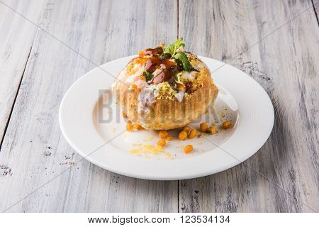 Rajasthani Shahi Raj Kachori, stuffed katchori with potato and sprout filling and served with curd, chutney and sev