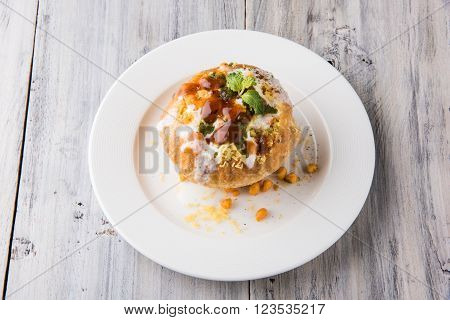 Rajasthani Shahi Raj Kachori, stuffed katchori with potato and sprout filling and served with curd, chutney and sev