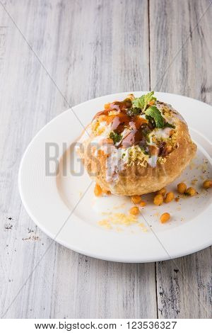 Rajasthani Shahi Raj Kachori, stuffed katchori with potato and sprout filling and served with curd, chutney and sev