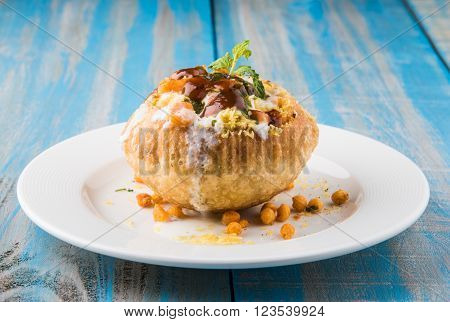 Rajasthani Shahi Raj Kachori, stuffed katchori with potato and sprout filling and served with curd, chutney and sev