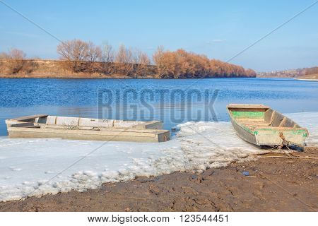 two fishing boats on the riverside in the springtime