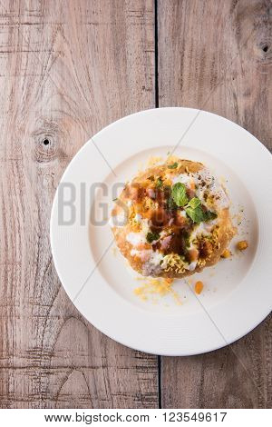 Rajasthani Shahi Raj Kachori, stuffed katchori with potato and sprout filling and served with curd, chutney and sev