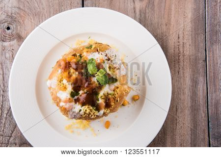 Rajasthani Shahi Raj Kachori, stuffed katchori with potato and sprout filling and served with curd, chutney and sev
