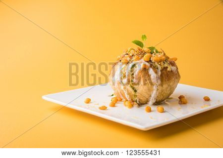 Rajasthani Shahi Raj Kachori, stuffed katchori with potato and sprout filling and served with curd, chutney and sev