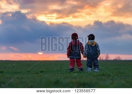 Two Adorable Children, Boy Brothers, Watching Beautiful Splendid Sunset