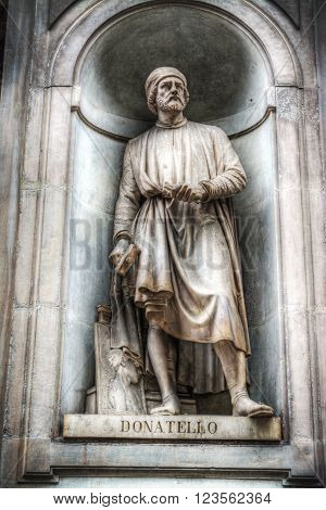 a marble statue of Donatello in Florence