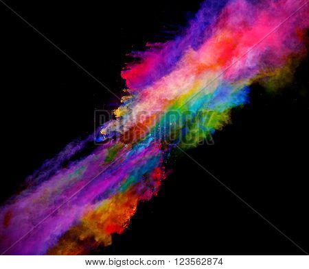 Explosion of colored powder on black background