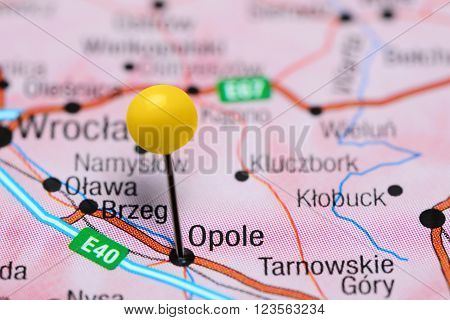 Photo of pinned Opole on a map of Poland. May be used as illustration for traveling theme.