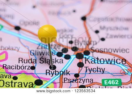 Photo of pinned Rybnik on a map of Poland. May be used as illustration for traveling theme.