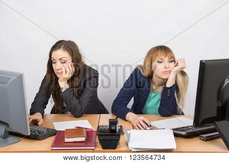 Two Young Office Employee Tired Of Working At Computers