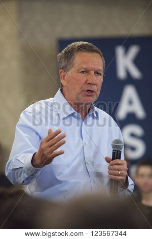 MADISON WI/USA - March 28 2016: Republican presidential candidate John Kasich speaks to a group of supporters during a town hall event before the Wisconsin presidential primary in Madison Wisconsin.