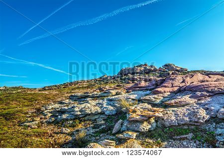 some purple rocks in Sardinian rocky coastline