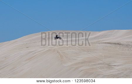 LANCELIN,WA,AUSTRALIA-SEPTEMBER 28,2015: Motorbike activity at the white sand dunes under a blue sky Lancelin, Western Australia.