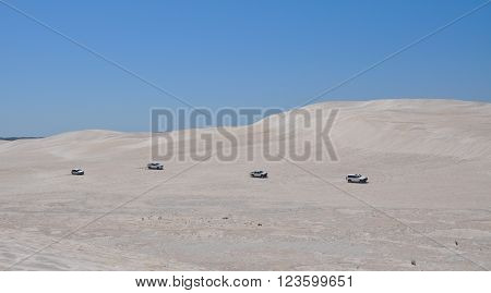 LANCELIN,WA,AUSTRALIA-SEPTEMBER 28,2015: Four recreational vehicles off road at the white sand dunes tourist attraction in Lancelin, Western Australia.