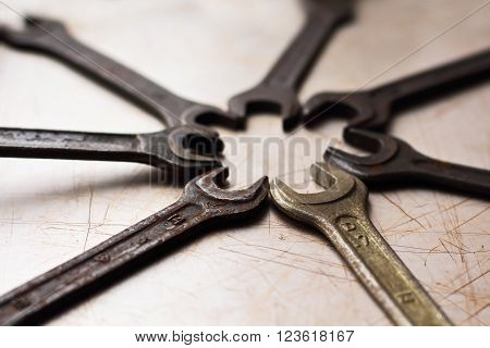 tools circle on the old metal scratched background