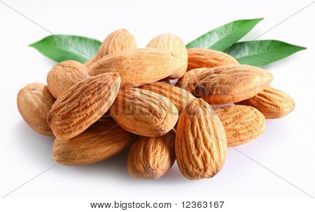 Almonds with leaves on white background