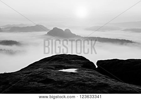 Dreamy Misty Landscape. Majestic Mountain Cut The Lighting Mist. Deep Valley Is Full Of Colorful Fog
