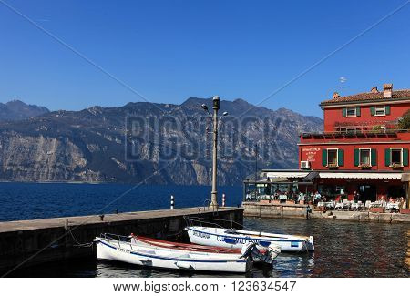 Malcesine, Italy - March 17, 2016: View of Malcesine town center and small port. Malcesine is located on the eastern shore of Lake Garda in the Province of Verona in the Italian region Veneto