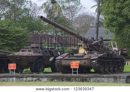 HUE, VIETNAM - JANUARY 08, 2016: An armored personnel carrier and 175 mm self-propelled artillery installation in the city of Hue