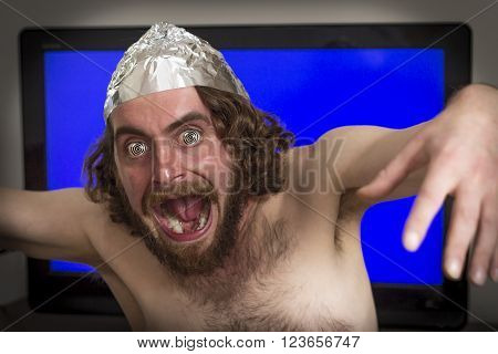 Brain washed crazy man is hypnotized by television program