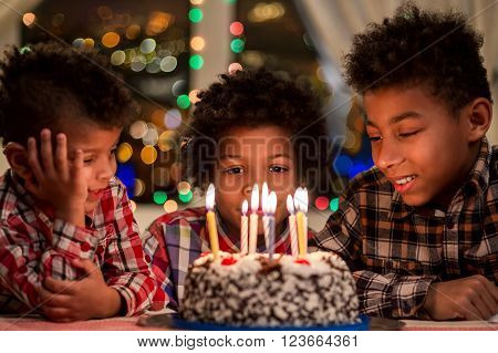 Kids sitting beside birthday cake. Boys near cake with candles. Birthday table beside window. Hurry up, it's night already.
** Note: Soft Focus at 100%, best at smaller sizes