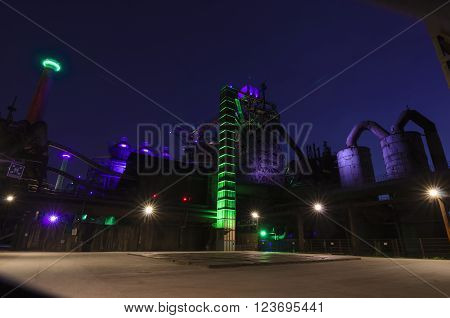 Duisburg, Germany - May 18, 2015: Nocturnal shot of Landschaftspark Nord illuminated industrial plant in Duisburg Germany. Landschaftspark is a public park located in Duisburg-Meiderich, Germany.