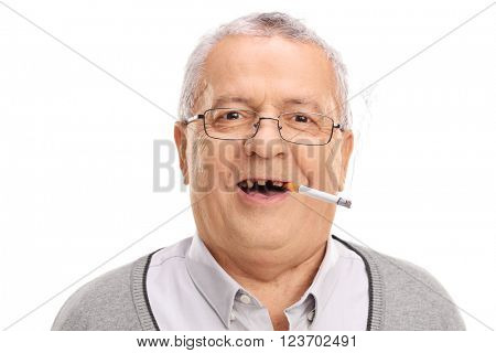 Portrait of a toothless senior smoking a cigarette and looking at the camera isolated on white background