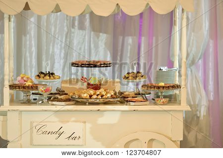 Candy bar with many cakes in natural ligth
