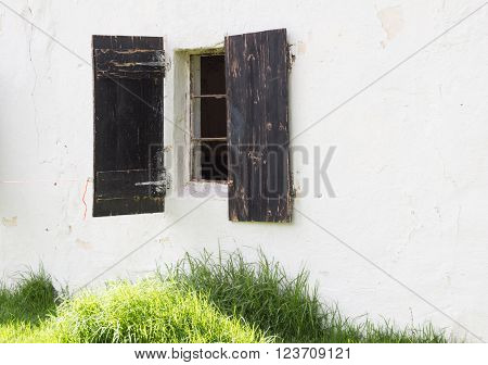Shot of old horse stable window in building