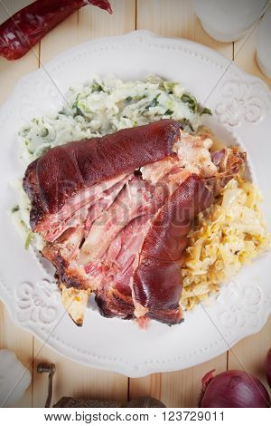 Roasted pork knuckle with sour cabbage and mashed potato