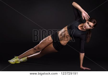 Fitness Woman Doing Exercises Isolated On Black Background