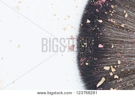 top view of makeup brush with blusher cracked on white backgrounds
** Note: Shallow depth of field