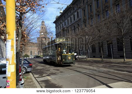 MILAN ITALY - FEBRUARY 08 2010 Old traditional tram ATM on the street of Milan used as moving restaurant ATMOSFERA on February 8 2015. Milan tramway network operation since 1881.