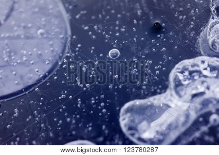 abstract air bubbles inside the ice macro closeup image
