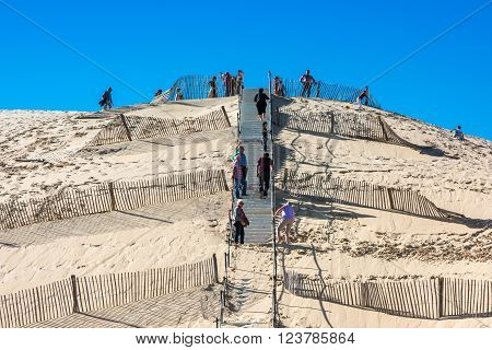 People Visiting The Highest Sand Dune Of Pyla In Europe