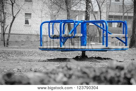 single carousel in the yard without children