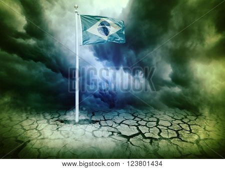 mast with the Brazil flag coming out of hole in cracked ground