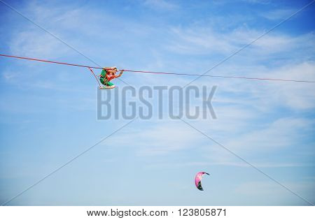 Highline walker stumbling while in participating in competition at extreme sports festival on August 24, 2015 in Karolino-Bugaz, Ukraine.Ukraine.