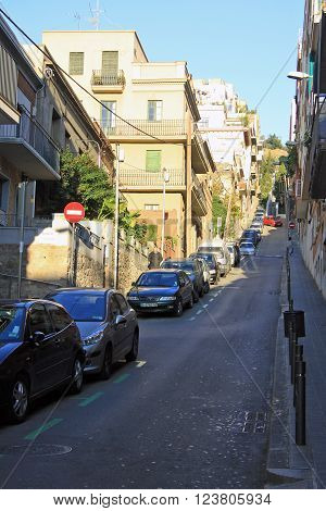 Barcelona, Catalonia, Spain - December 12, 2011: Road To Park Guell In Barcelona With Parked Cars