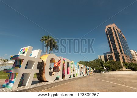 RIO DE JANEIRO, BRAZIL - MARCH 21, 2016: Large colorful sign #CIDADEOLIMPICA (Olympic city) stands in Maua Plaza in the regenerated port area.