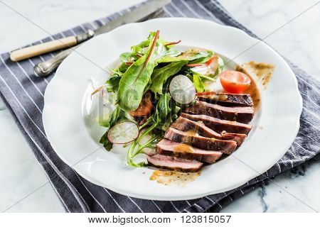 steak with salad