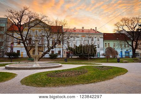 KOSICE, SLOVAKIA - MARCH 19, 2016: Park and historic architecture in the main square of Kosice city in eastern Slovakia on March 19, 2016.