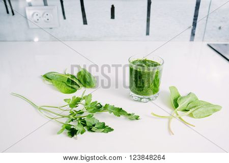 Green vegetable juice (smoothie) organic from natural at on white table